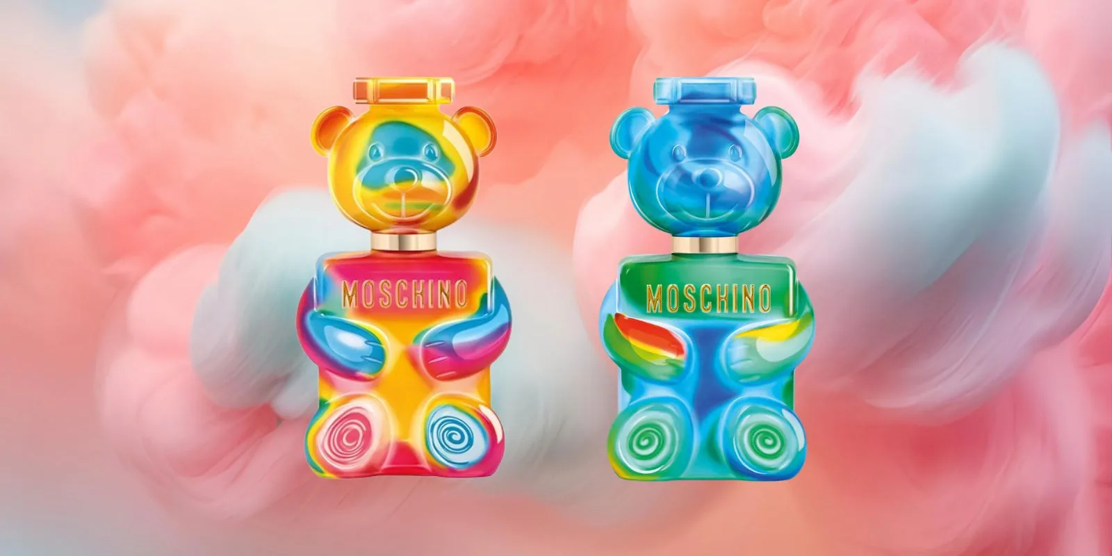 The two Toy 2 Gummy Yummy bottles against candy-floss clouds