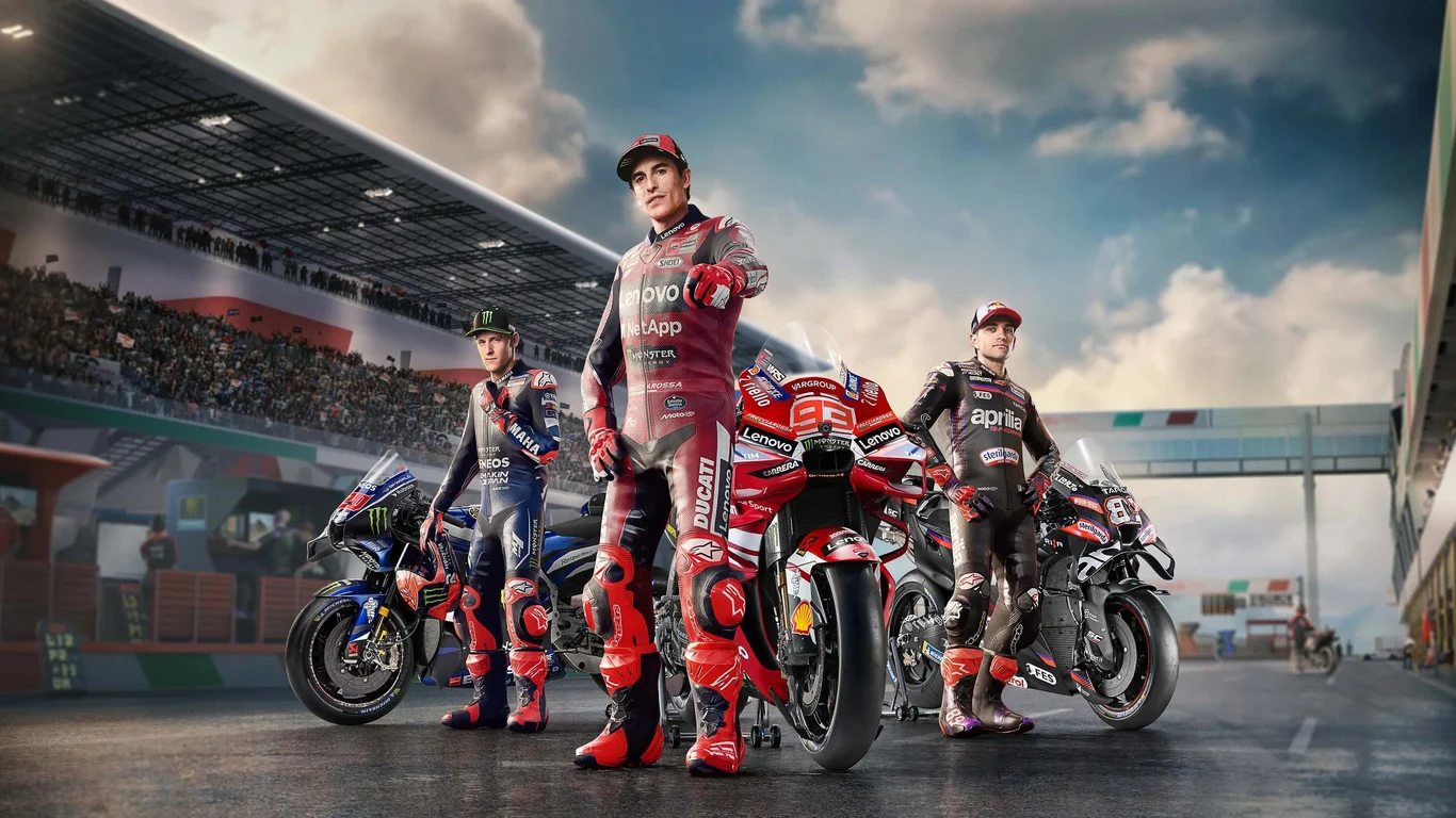 MotoGP™26 key art: Ducati, Yamaha and Aprilia riders with their bikes on pit lane before a packed grandstand