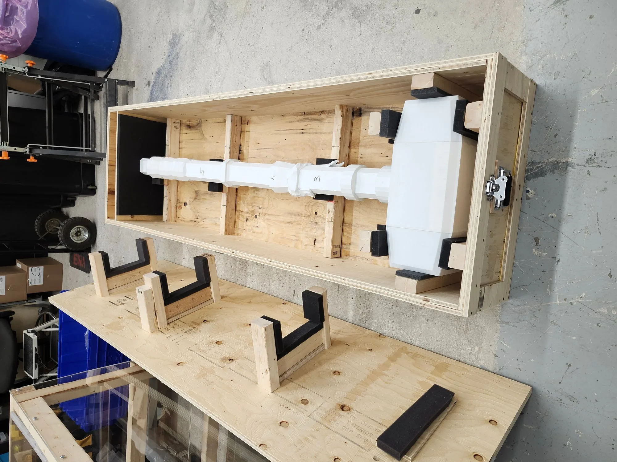 The hammer packed in its custom foam-lined crate