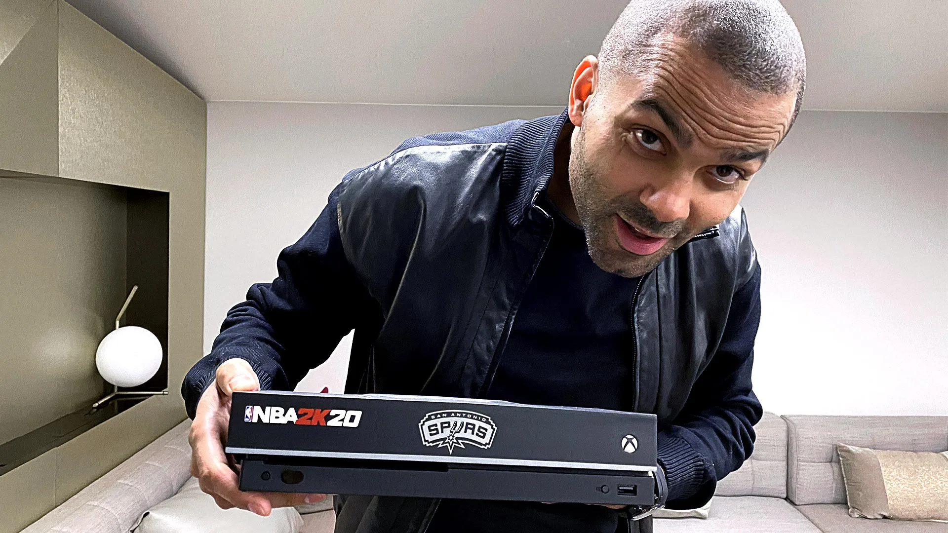 Tony Parker holding his custom Xbox One X console